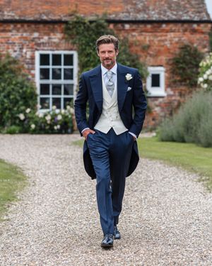 Navy Blue Morning Coat with Ivory Waistcoat and Pinstriped Trousers