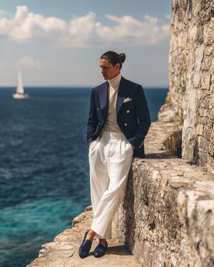 Navy Double-Breasted Blazer with Ivory Turtleneck and White Trousers