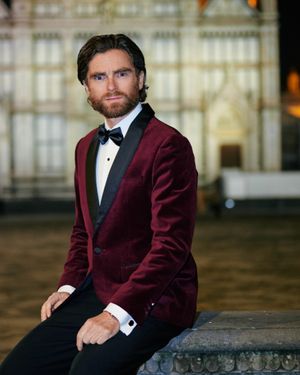 burgundy-velvet-tuxedo-jacket-black-tailored-trousers