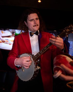 Red Velvet Tuxedo Jacket with Black Tailored Trousers
