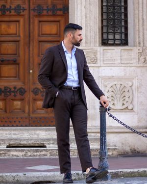 Dark Brown Suit with Light Blue Open-Collar Shirt