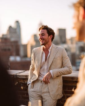 beige-linen-suit-white-open-collar-shirt