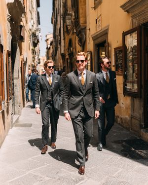 charcoal-three-piece-suit-gold-tie