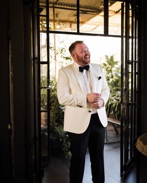 Ivory Dinner Jacket with Black Trousers and Black Bow Tie
