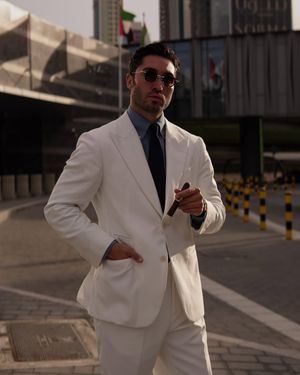 White Suit with Blue Shirt and Black Tie