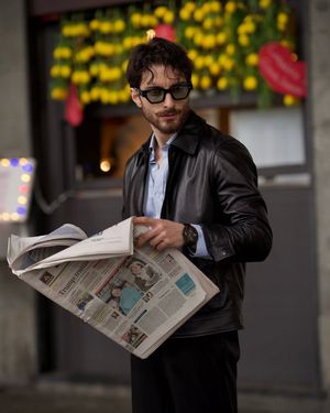 Black Leather Jacket with Light Blue Shirt and Black Trousers