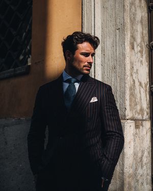 Pinstripe Double-Breasted Suit with Blue Shirt