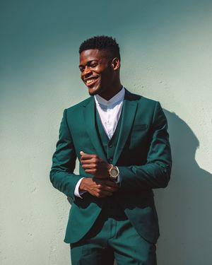 Green Three-Piece Suit with White Band Collar Shirt