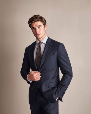 navy-suit-striped-shirt-brown-tie