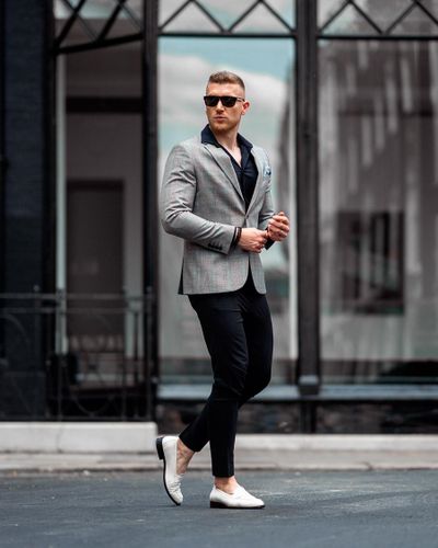 White loafers and black pants | Hockerty