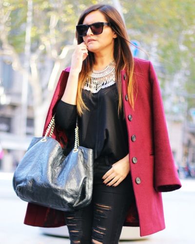 Burgundy coat, black blouse and black jeans