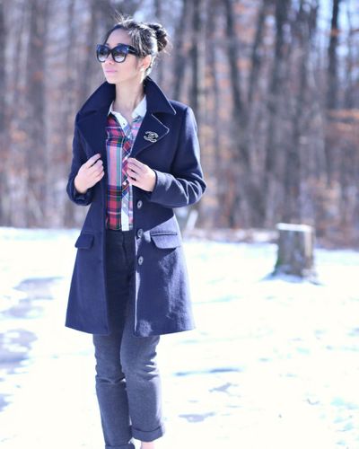 Blue coat over red checked shirt